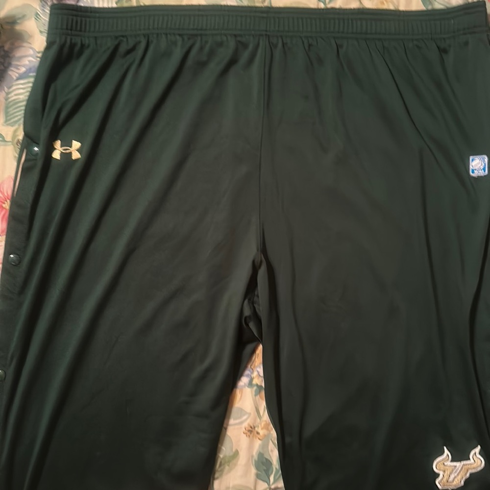 A green pair of South Florida Bulls under Armour snap pants. All snaps work.